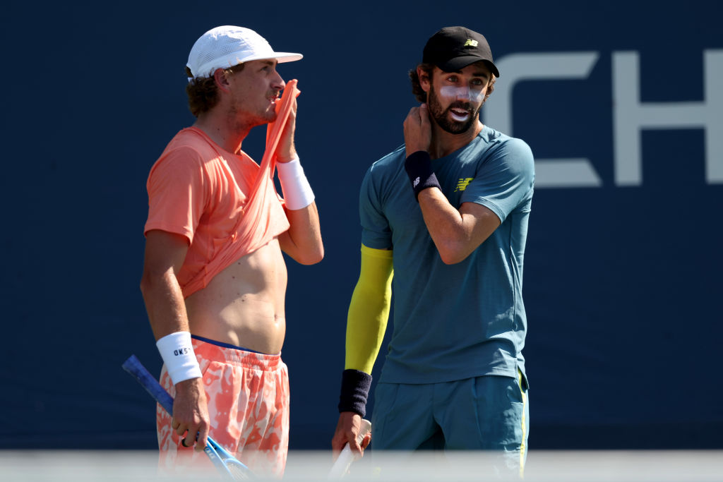 NEW YORK, NEW YORK - AUGUST 28:  Max Purcell (L) and Jordan Thompson of Australia in action against Marcos Giron of the United States and Botic Van De Zandschulp during their Men's Doubles First Round match on Day Three of the 2024 US Open at USTA Billie Jean King National Tennis Center on August 28, 2024 in the Flushing neighborhood of the Queens borough of New York City. (Photo by Jamie Squire/Getty Images)