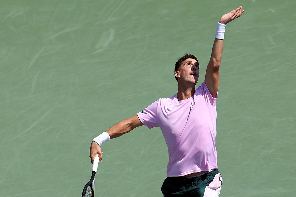 NEW YORK, NEW YORK - AUGUST 27:  Thanasi Kokkinakis of Australia serves against Stefanos Tsitsipas of Greece during their Men's Singles First Round match on Day Two of the 2024 US Open at the USTA Billie Jean King National Tennis Center on August 27, 2024 in the Flushing neighborhood of the Queens borough of New York City. (Photo by Luke Hales/Getty Images)