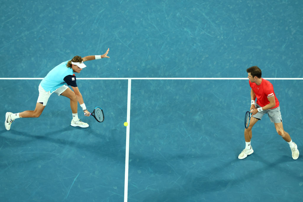 MELBOURNE, AUSTRALIA - JANUARY 29: Max Purcell of Australia plays a backhand in his Men's Doubles Final match with Matthew Ebden of Australia against Nick Kyrgios of Australia and Thanasi Kokkinakis of Australia during day 13 of the 2022 Australian Open at Melbourne Park on January 29, 2022 in Melbourne, Australia. (Photo by Clive Brunskill/Getty Images)