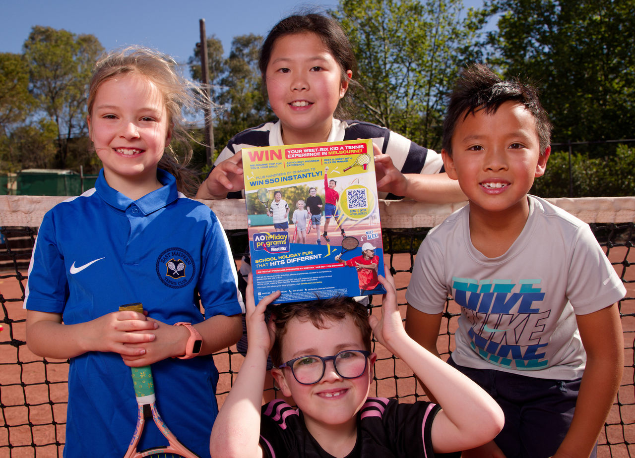 October 16: Sarah, Luna, Darcy and William are surprised to be shown they will be featured on the Weet-Bix box at East Malvern Tennis Club on Thursday, October 16, 2025. Photo by TENNIS AUSTRALIA/HAMISH BLAIR