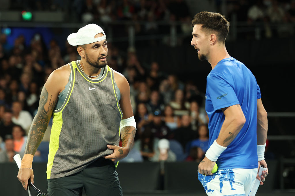 MELBOURNE, AUSTRALIA - JANUARY 16: Nick Kyrgios and Thanasi Kokkinakis of Australia speak in the Men's Doubles First Round match against James Duckworth and Aleksandar Vukic of Australia during day five of the 2025 Australian Open at Melbourne Park on January 16, 2025 in Melbourne, Australia. (Photo by Cameron Spencer/Getty Images)