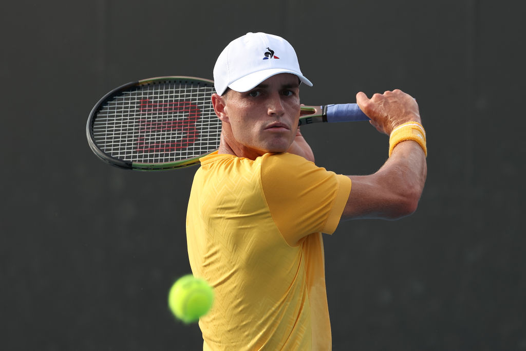 MELBOURNE, AUSTRALIA - JANUARY 17: Christopher O’Connell of Australia plays a backhand in their round one singles match against Jenson Brooksby of the United States during day two of the 2023 Australian Open at Melbourne Park on January 17, 2023 in Melbourne, Australia. (Photo by Cameron Spencer/Getty Images)