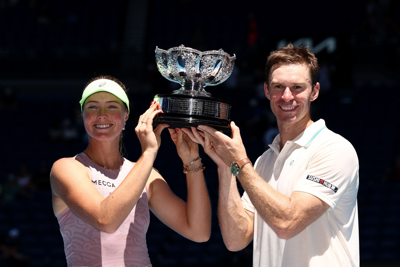 MELBOURNE, AUSTRALIA - JANUARY 30: Olivia Gadecki (L) and John Peers (R) of Australia pose with the trophy after winning in the Mixed Doubles Final against Kristina Mladenovic and Manuel Guinard of France during day 13 of the 2026 Australian Open at Melbourne Park on January 30, 2026 in Melbourne, Australia. (Photo by Phil Walter/Getty Images)