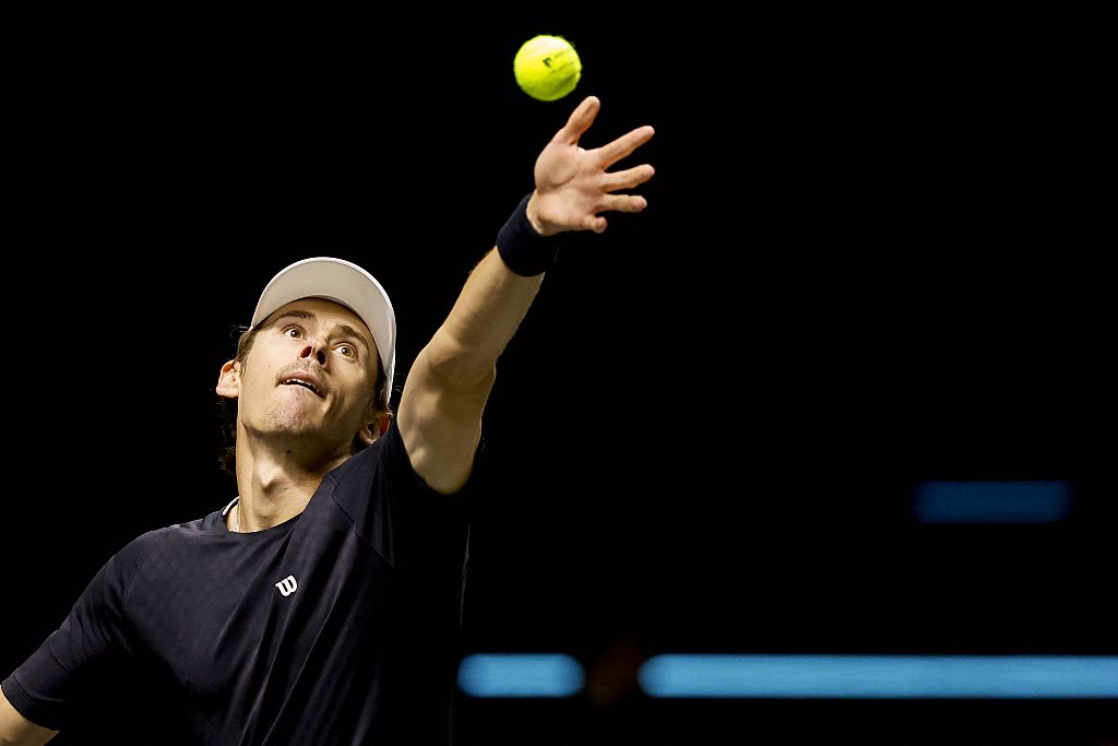 Australia's Alex De Minaur serves to Netherlands' Botic van de Zandschulp during their Rotterdam Open ATP tournament quarter-final tennis match in Rotterdam on February 13, 2026. (Photo by Bas CZERWINSKI / ANP / AFP via Getty Images) / Netherlands OUT