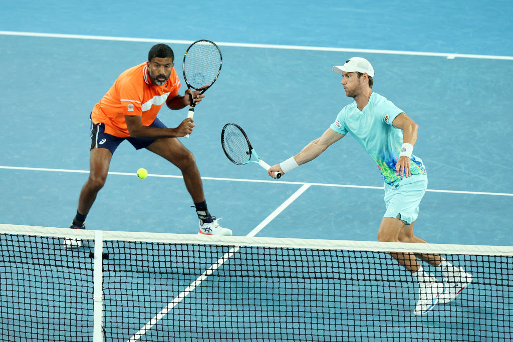 MELBOURNE, AUSTRALIA - JANUARY 27: Matthew Ebden of Australia plays a forehand in their Men’s Doubles Final match against Simone Bolelli and Andrea Vavassori of Italy during the 2024 Australian Open at Melbourne Park on January 27, 2024 in Melbourne, Australia. (Photo by Daniel Pockett/Getty Images)