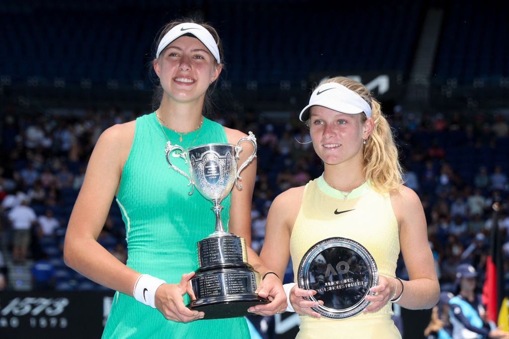 Slovakia's Renata Jamrichova (L) poses with the winner's trophy next to Australia's Emerson Jones during their junior girls' singles final match on day 14 of the Australian Open tennis tournament in Melbourne on January 27, 2024. (Photo by Martin KEEP / AFP) / -- IMAGE RESTRICTED TO EDITORIAL USE - STRICTLY NO COMMERCIAL USE -- (Photo by MARTIN KEEP/AFP via Getty Images)