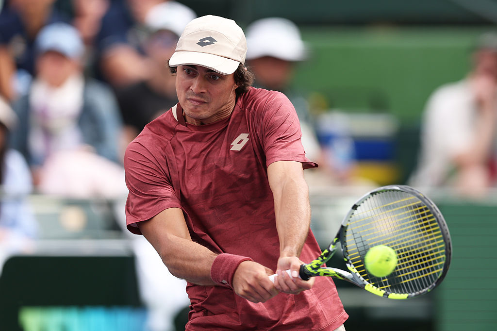 INDIAN WELLS, CALIFORNIA - MARCH 06:  Adam Walton of Australia plays a backhand against Learner Tien of the United States in their second round match of the BNP Paribas Open at Indian Wells Tennis Garden on March 06, 2026 in Indian Wells, California. (Photo by Clive Brunskill/Getty Images)