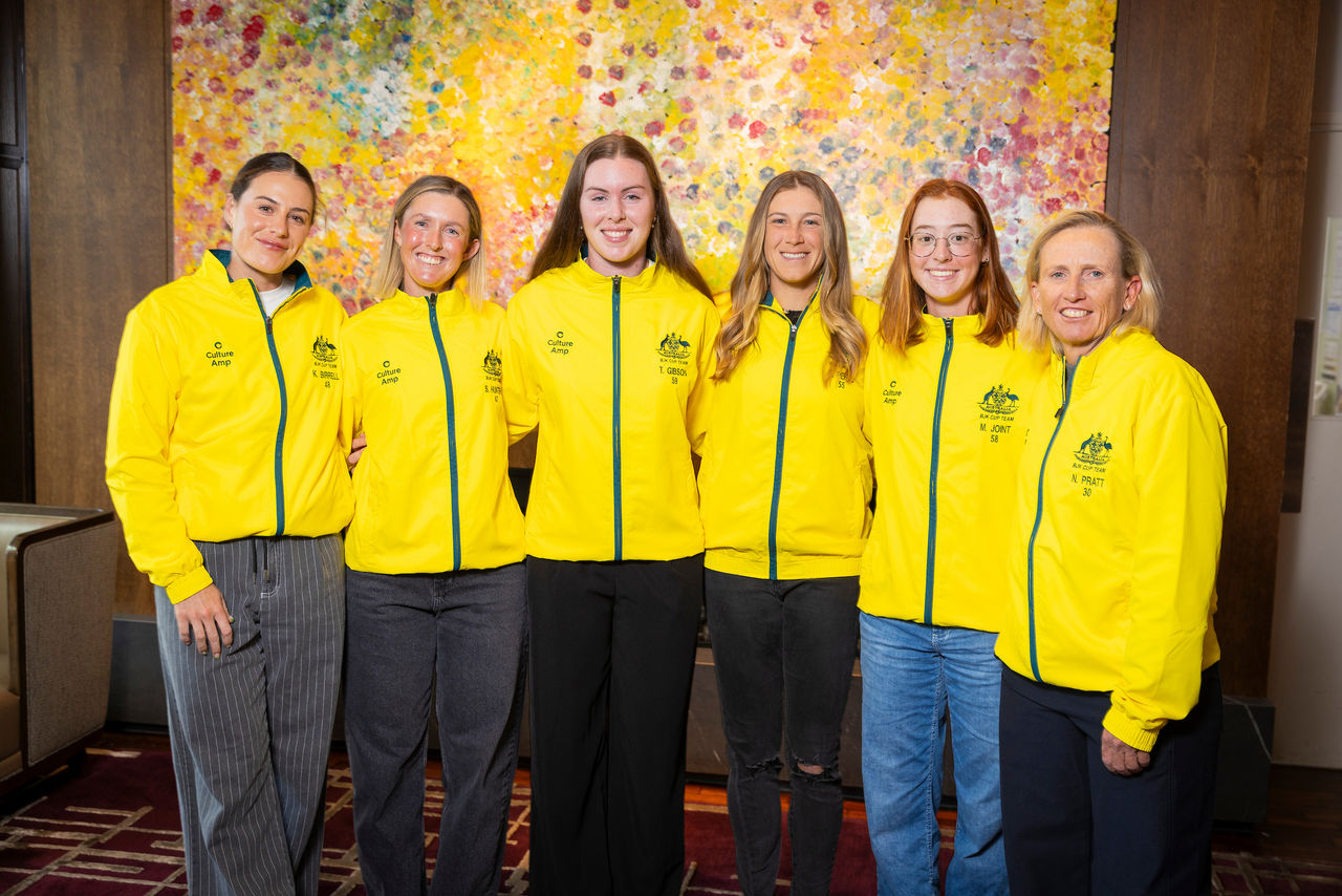 November 10: Talia Gibson (AUS) centre, is presented with her yellow jacket as she debuts in the Australian team. Billie Jean King Cup play-off at Domain Tennis Centre, Hobart, Tasmania on Monday, November 10, 2025. Photo by TENNIS AUSTRALIA/ RICHARD JUPE