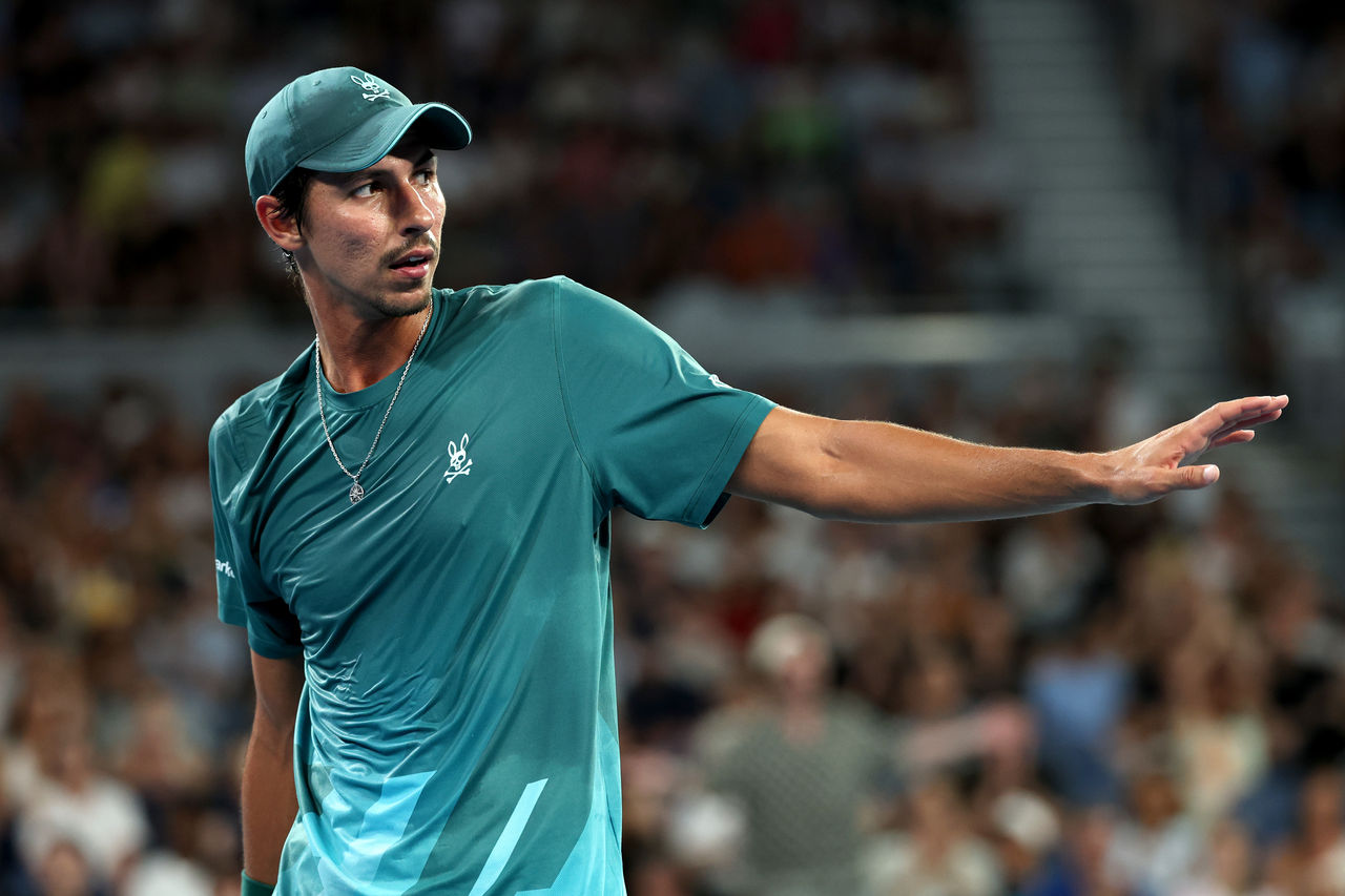 MELBOURNE, AUSTRALIA - JANUARY 19: Alexei Popyrin of Australia reacts against Alexandre Muller of France during the Men's Singles First Round match on day two of the 2026 Australian Open at Melbourne Park on January 19, 2026 in Melbourne, Australia. (Photo by Phil Walter/Getty Images)
