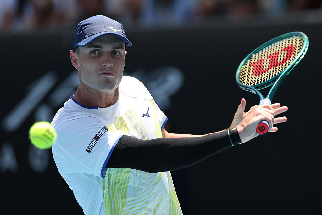 MELBOURNE, AUSTRALIA - JANUARY 20: Christopher O'Connell of Australia plays a backhand against Nishesh Basavareddy of the United States in the Men's Singles First Round during day three of the 2026 Australian Open at Melbourne Park on January 20, 2026 in Melbourne, Australia. (Photo by Cameron Spencer/Getty Images)