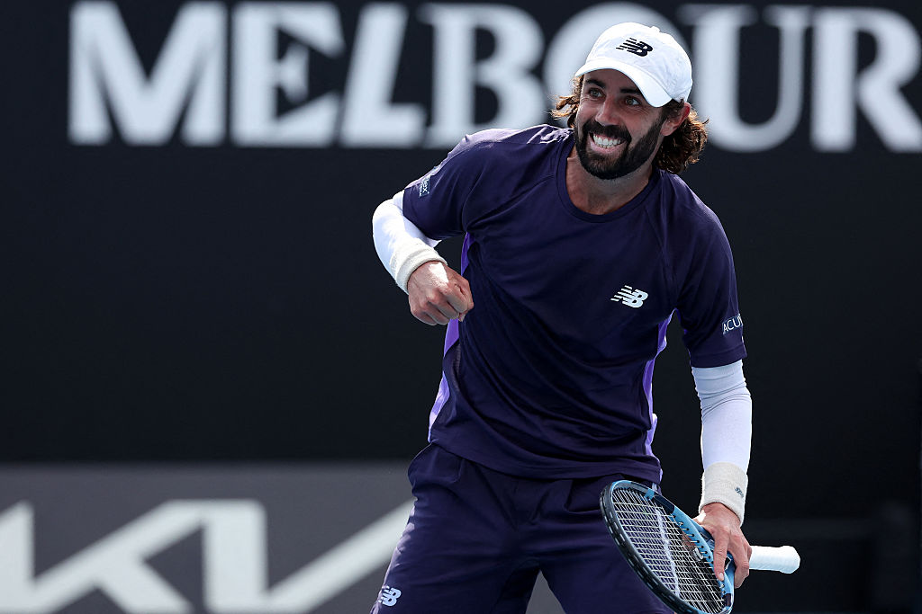 Australia's Jordan Thompson celebrates a match point against Argentina's Juan Manuel Cerundolo after their men's singles match on day two of the Australian Open tennis tournament in Melbourne on January 19, 2026. (Photo by Martin KEEP / AFP via Getty Images) / -- IMAGE RESTRICTED TO EDITORIAL USE - STRICTLY NO COMMERCIAL USE --