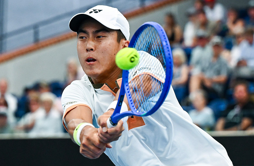 ADELAIDE, AUSTRALIA - JANUARY 13: Rinky Hijikata of Australia plays a back hand in his match against Tristan Schoolkate of Australia  during day two of the 2026 Adelaide International at Memorial Drive on January 13, 2026 in Adelaide, Australia. (Photo by Mark Brake/Getty Images)