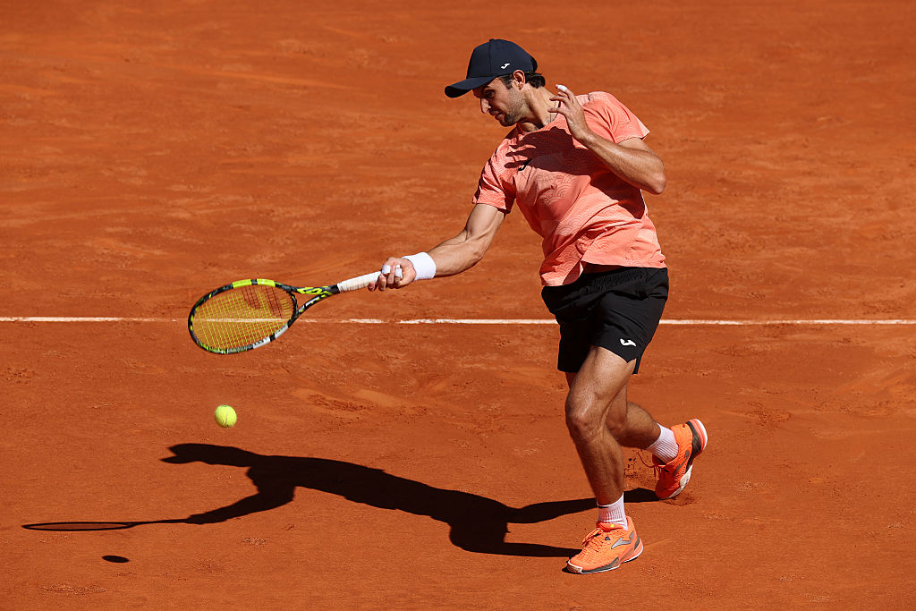MADRID, SPAIN - APRIL 24: Aleksandar Vukic of Australia plays a forehand against Kei Nishikori of Japan in the Men's Singles First Round match during Day Three of the Mutua Madrid Open at La Caja Magica on April 24, 2025 in Madrid, Spain.  (Photo by Clive Brunskill/Getty Images)