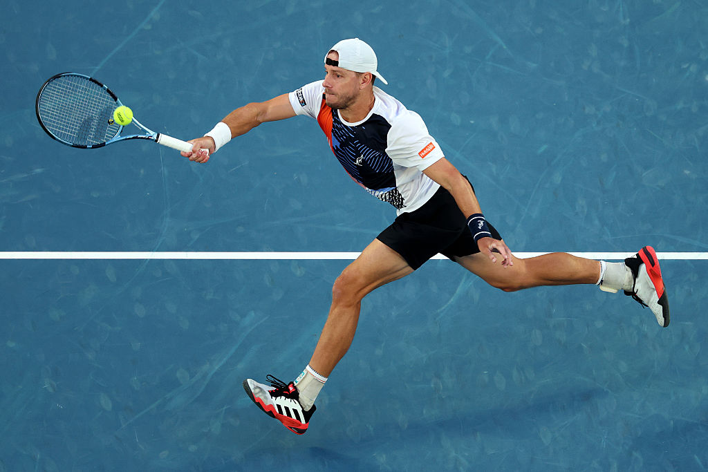 MELBOURNE, AUSTRALIA - JANUARY 22: James Duckworth of Australia plays a forehand against Jannik Sinner of Italy in the Men's Singles Second Round during day five of the 2026 Australian Open at Melbourne Park on January 22, 2026 in Melbourne, Australia. (Photo by Morgan Hancock/Getty Images)