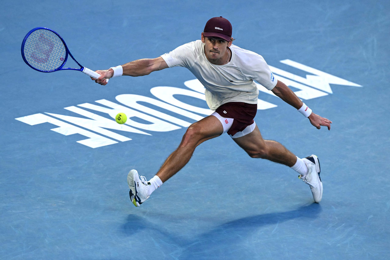 Australia's Alex De Minaur hits a return to USA's Frances Tiafoe during their men's singles match on day six of the Australian Open tennis tournament in Melbourne on January 23, 2026. (Photo by WILLIAM WEST / AFP via Getty Images) / -- IMAGE RESTRICTED TO EDITORIAL USE - STRICTLY NO COMMERCIAL USE --