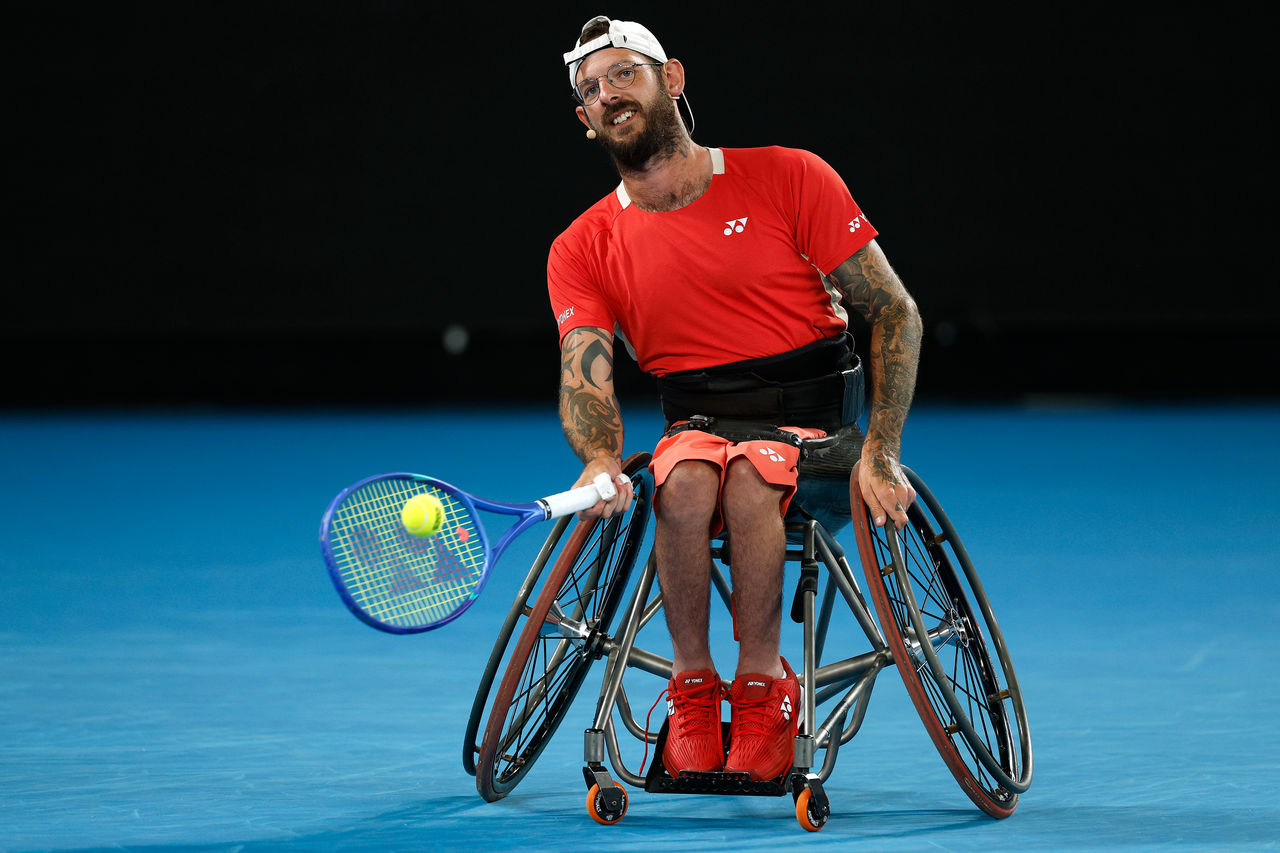 MELBOURNE, AUSTRALIA - JANUARY 09: Heath Davidson of Australia plays a forehand in his doubles match with Dylan Alcott of Australia against Novak Djokovic of Serbia and Tokito Oda of Japan during the Night with Novak charity event ahead of the 2025 Australian Open at Melbourne Park on January 09, 2025 in Melbourne, Australia. (Photo by Daniel Pockett/Getty Images)