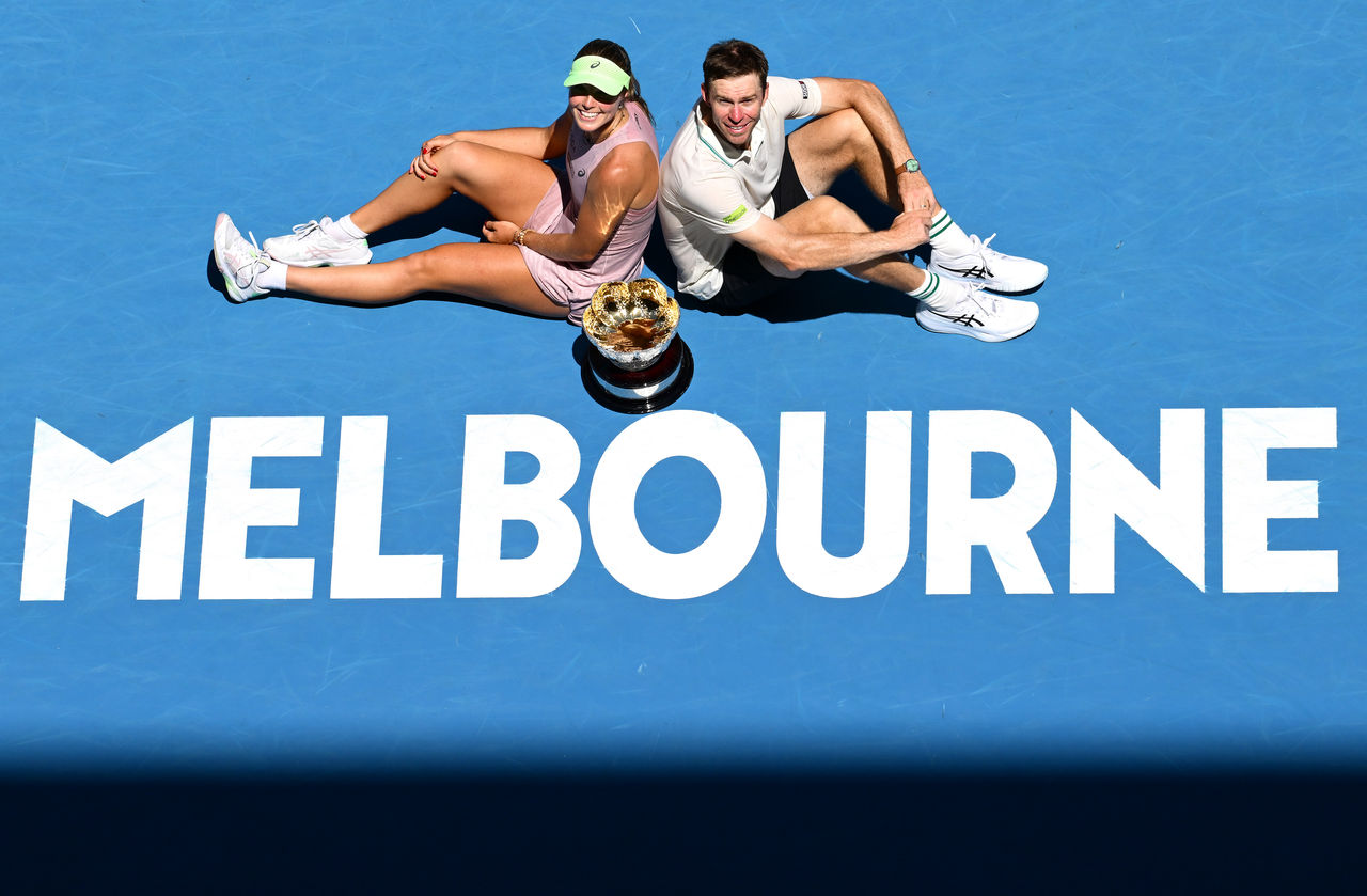 MELBOURNE, AUSTRALIA - JANUARY 30: Olivia Gadecki (L) and John Peers (R) of Australia pose with the trophy after winning in the Mixed Doubles Final against Kristina Mladenovic and Manuel Guinard of France during day 13 of the 2026 Australian Open at Melbourne Park on January 30, 2026 in Melbourne, Australia. (Photo by Quinn Rooney/Getty Images)