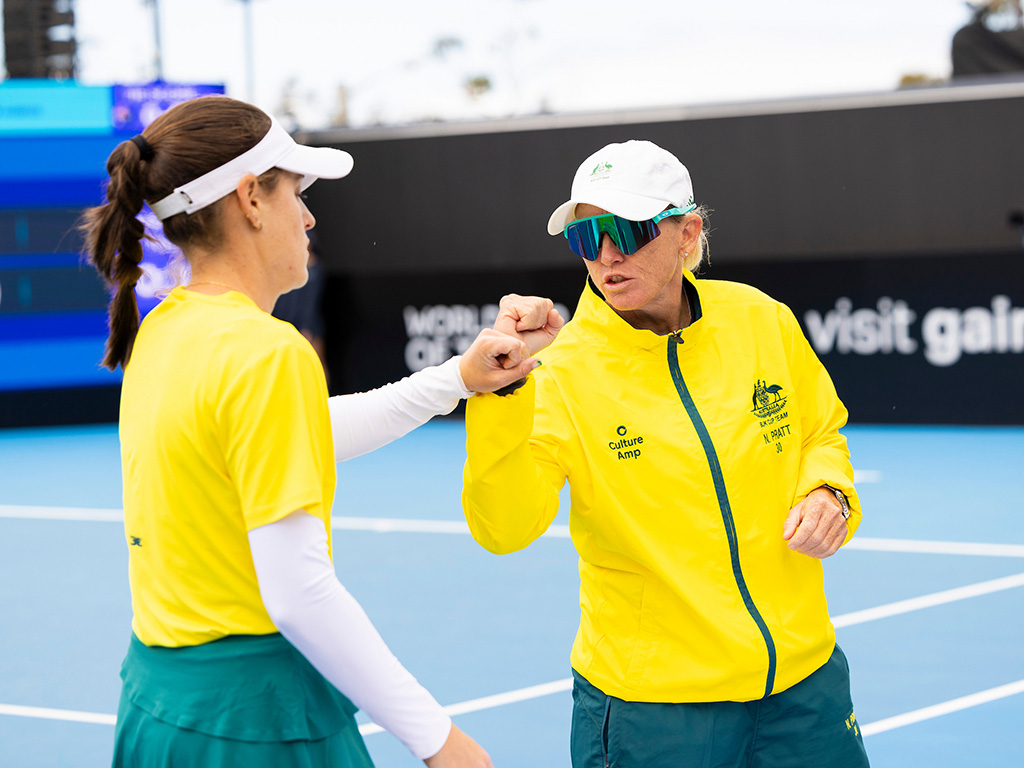 November 14: Kimberly Birrell (AUS) celebrates winning the first set with Captain Nicole Pratt (AUS) in the match with Matilde Jorge (POR) during the Billie Jean King Cup play-off at Domain Tennis Centre, Hobart, Tasmania on Friday, November 14, 2025. Photo by TENNIS AUSTRALIA/ RICHARD JUPE