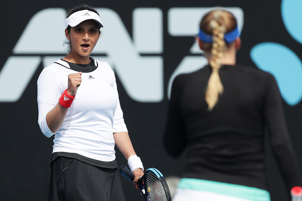 HOBART, AUSTRALIA - JANUARY 17: Nadiia Kichenok of Ukraine and Sania Mirza of India celebrate winning match point during their semi final doubles match against Maria Bouzkova of Czech Republic and Tamara Zidansek of Slovakia during day seven of the 2020 Hobart International at Domain Tennis Centre on January 17, 2020 in Hobart, Australia. (Photo by Mark Metcalfe/Getty Images)