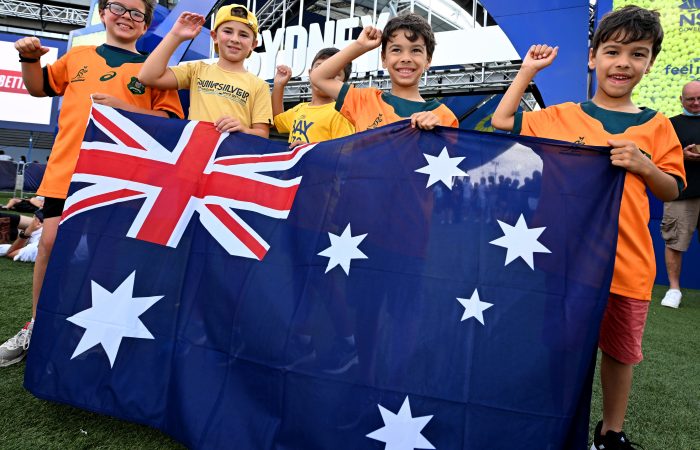 Children pose with the Australian flag in the Fan Zone on day 6 of the 2022 ATP Cup at Sydney Olympic Park on Thursday, January 6, 2022. MANDATORY PHOTO CREDIT Dan Peled/TENNIS AUSTRALIA