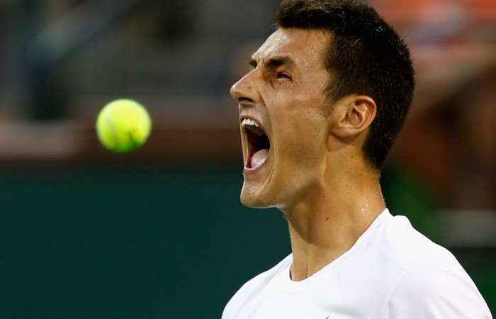 Bernard Tomic celebrates his fourth-round defeat pf compatriot Thanasi Kokkinakis at the 2015 BNP Paribas Open in Indian Wells, California; Getty