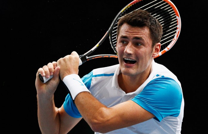 Bernard Tomic in action during his second-round loss to Stan Wawrinka at the ATP Paris Masters; Getty Images