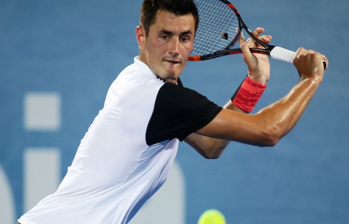 SYDNEY, AUSTRALIA - JANUARY 13:  Bernard Tomic of Australia plays a backhand in his match against Jordan Thompson of Australia during day four of the Sydney International at Sydney Olympic Park Tennis Centre on January 13, 2016 in Sydney, Australia.  (Photo by Matt King/Getty Images)