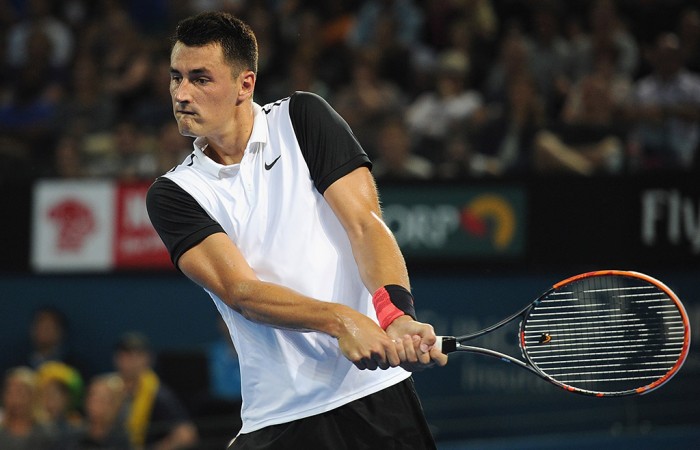 Bernard Tomic playds a backhand en route to victory over Nicolas Mahut in the first round of Brisbane International 2016; Getty Images