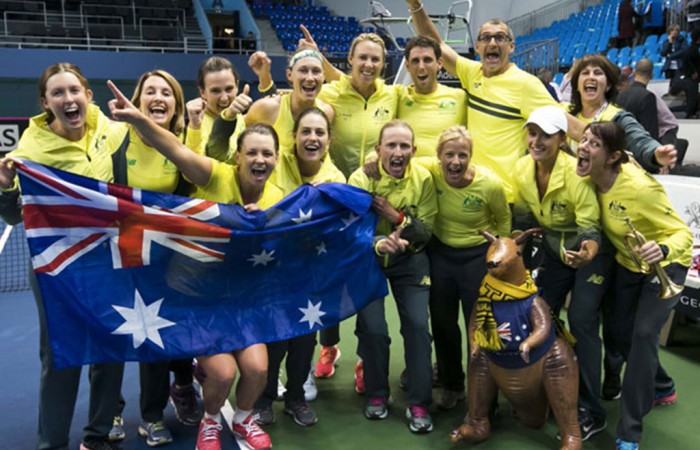 Australia's Fed Cup team celebrates its 3-2 victory over Slovakia in Bratislave to advance to the World Group Play-offs; Roman Benicky