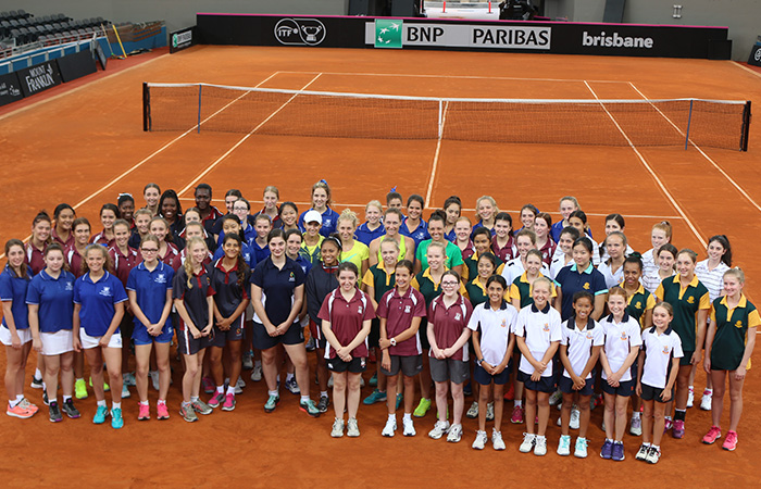 Brisbane school girls on court with Arina Rodionova, Daria Gavrilova, Sam Stosur and Casey Dellacqua