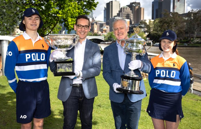AO23 Ballkid Leaders Emma and Euan, The Hon. Steve Dimopoulos, Minister for Tourism, Sport and Major Events and John Fitzgerald, former Australian Davis Cup captain and Grand Slam doubles champion with the Norman Brookes Challenge Cup and the Daphne Ackhurst Memorial Cup. 100 day countdown to Australian Open 2023  and launch AO on the Road.  Yarra River Melbourne. Saturday, October 08, 2022. on MANDATORY PHOTO CREDIT TENNIS AUSTRALIA/FIONA HAMILTON