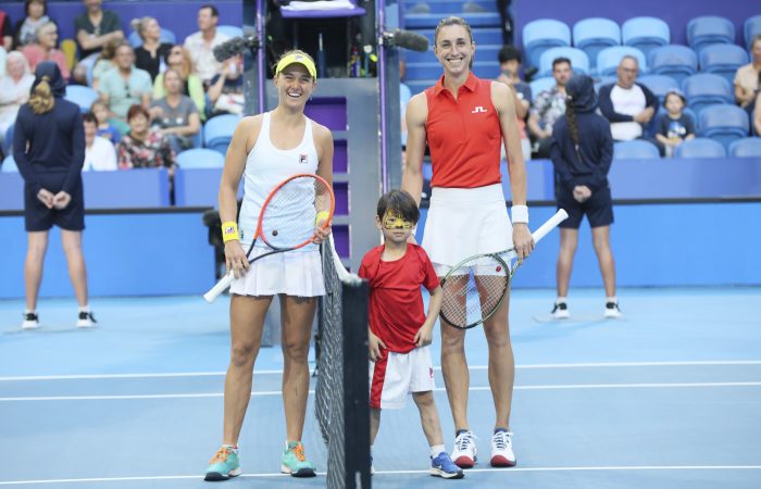 Ezekiel Tan tosses the coin before the match between Nadia Podoroska of Team Argentina (L) and Petra Martic of Team Croatia on RAC Arena during their Group F match on Day 4 of the 2023 United Cup in Perth on Sunday, January 1, 2023. MANDATORY PHOTO CREDIT Tennis Australia/ TREVOR COLLENS