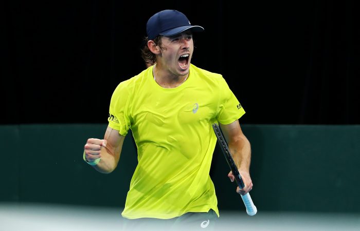 SYDNEY, AUSTRALIA - MARCH 05: Alex de Minaur of Australia celebrates winning set point in his singles match against Marton Fucsovics of Hungary during the 2022 Davis Cup Qualifier between Australia and Hungary at Ken Rosewall Arena on March 05, 2022 in Sydney, Australia. (Photo by Mark Metcalfe/Getty Images)