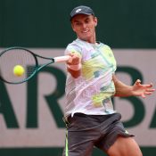 PARIS, FRANCE - MAY 25: Tristan Schoolkate of Australia plays a forehand against Marton Fucsovics of Hungary in the Men's Singles First Round match on Day One of the 2025 French Open at Roland Garros on May 25, 2025 in Paris, France. (Photo by Julian Finney/Getty Images)