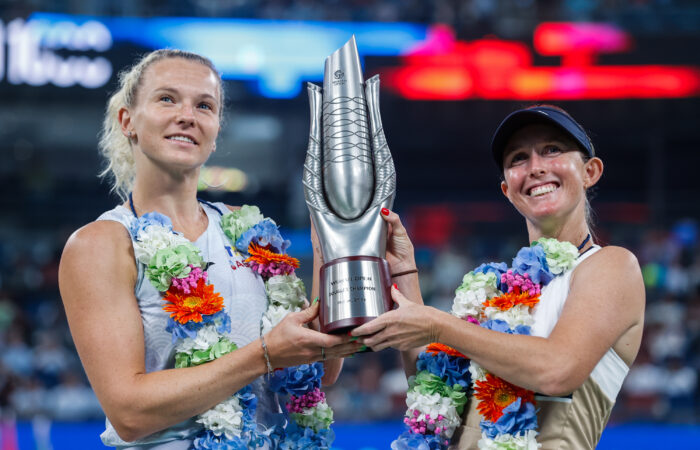 WUHAN, CHINA - OCTOBER 12: Storm Hunter of Australia and Katerina Siniakova of Czech Republic pose with the winners trophy after winning against  Anna Danilina of Kazakhstan and Aleksandra Krunic of Serbia during the Women's Doubles Final match award ceremony on Day 9 of the Wuhan Open at Optics Valley International Tennis Center on October 12, 2025 in Wuhan, China. (Photo by Wanghe/Getty Images)
