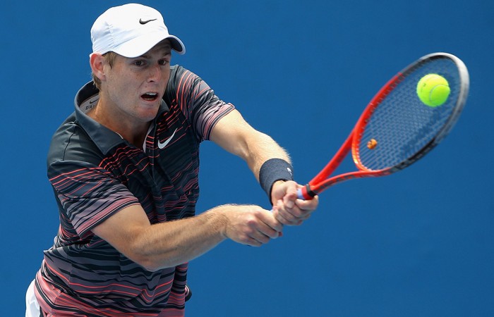 Luke Saville of Australia plays a backhand in his first round match of the Australian Open 2014 Qualifying at Melbourne Park on December 10, 2013 in Melbourne, Australia.  (Photo by Robert Prezioso/Getty Images)