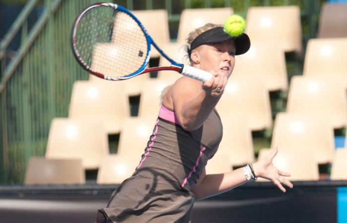 Sophie Letcher launches herself into a forehand on day 1 of the 2010 Optus 18s Australian Championships at Melbourne Park. JASON RETCHFORD