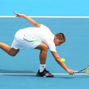 Youzhny is in perfect symmetry in this shot.