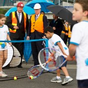 25th of March 2011. Steve Wood and Denis Napthine watch Hot Shots players at the launch of the next phase of Melbourne Park redevelopment. Tennis Australia.