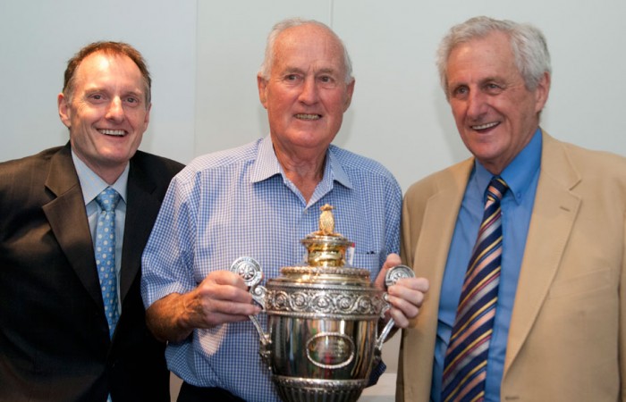 Author Richard Naughton, Wimbledon champion Neale Fraser and Sir Norman Brookes's grandson Norman Gengoult-Smith with Brookes' Wimbledon trophy. MAE DUMRIGUE