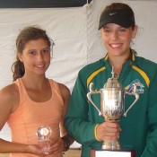 Aleksa Cvetacanin (R) holds aloft the winners trophy after defeating top seed and doubles partner Jaimee Fourlis in the girls singles final at the Optus 12s National Claycourt Championships; Tennis Australia