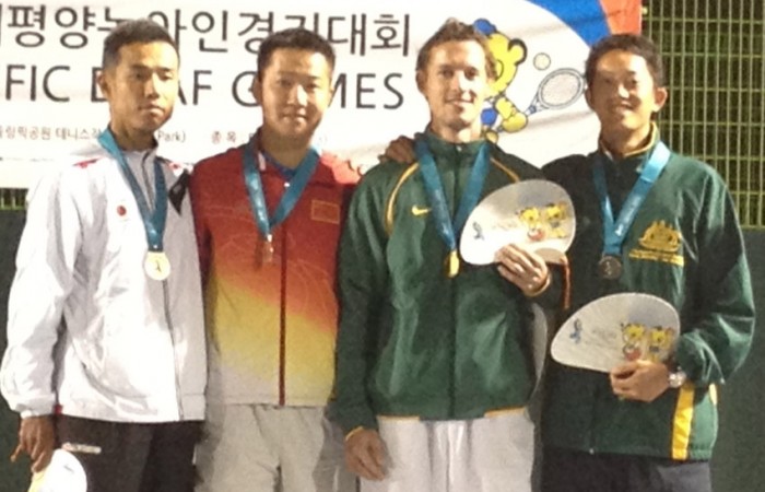Aussies Glen Flindell and John Lui (second from right and far right) on the podium with Japanese pair, Ashino and Kajino, who they defeated 6-2 6-1 in the men’s doubles final at the Asia Pacific Deaf Games; Tennis Australia