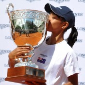 Australian Destanee Aiava kisses the trophy after winning the Longines Future Aces event at Roland Garros, an event for top international juniors aged 13-and-under; Longines
