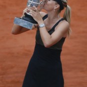 Russia's Maria Sharapova kisses her trophy after winning the French Open women's final to complete her career set of Grand Slam titles; Getty Images