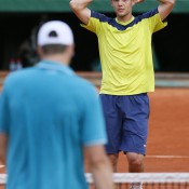 France's Paul-Henri Mathieu approaches the net to shake hands with John Isner after their five hour, 41 minute epic in the second round at Roland Garros; Getty Images
