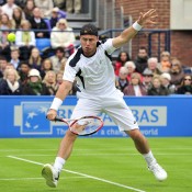 Lleyton Hewitt plays a volley in his first round match against Ivo Karlovic at the Queens Club ATP event in London; Getty Images