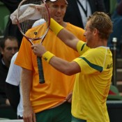 Lleyton Hewitt celebrates while Chris Guccione looks on. TENNIS AUSTRALIA