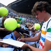Milos Raonic signs autographs for clamouring fans after defeating Andy Murray in the semifinals of the Japan Open in Tokyo; Getty Images