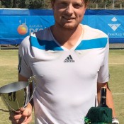 Matthew Barton poses with his trophy after defeating Harry Bourchier in the men's singles final of the Mildura Grand International