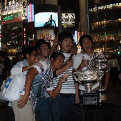 Fans pose with the Australian Open trophies in Beijing, China; Osports Photo Agency